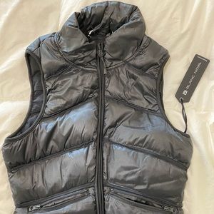 Black sleeveless down puffer vest.